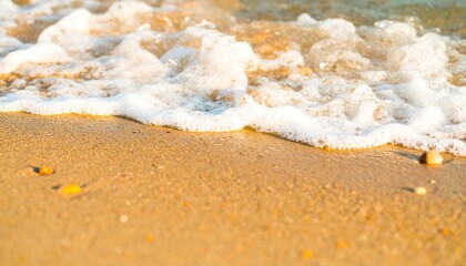 Foamy waves on a sandy beach