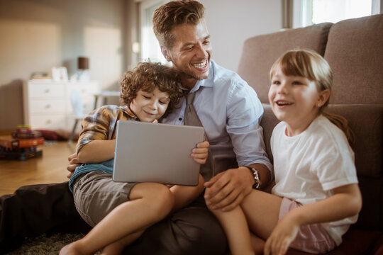 Family enjoying time together with tablet