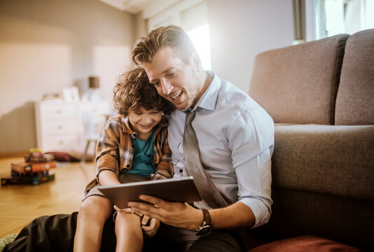 Father and son enjoying tablet together