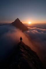 Fototapeta premium Lone hiker silhouetted on a mountain ridge, witnessing a breathtaking sunrise above the clouds and misty peaks.