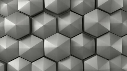 A dynamic and abstract background features a seamless tessellation of three-dimensional hexagonal shapes. These polished, silver-toned geometric forms exhibit subtle reflections and shadows, creating - Powered by Adobe
