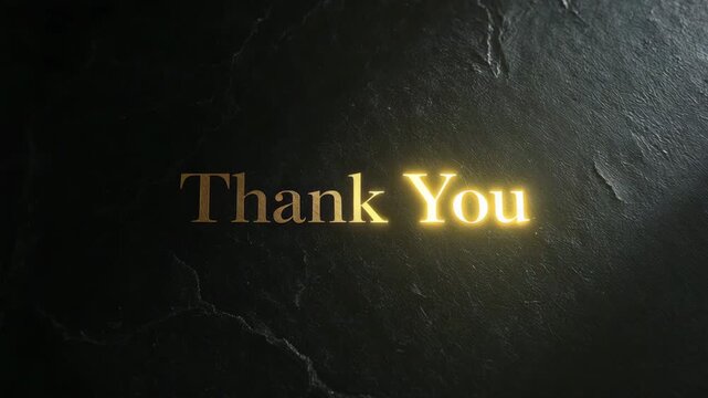 Thank you text in gold color on a dark stone background with light effect