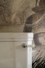 Modern restroom design featuring a sleek toilet bowl in a stylish hotel bathroom
