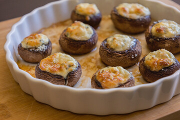 baked champignon mushrooms stuffed with herb cream cheese and topped with parmesan. Perfect for illustrating cozy fall appetizers, party snacks