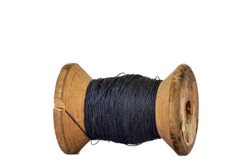 Vintage wooden thread spool on white background
