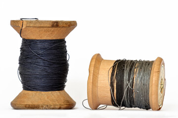 Pair of vintage wooden thread spools rustic needlework concept
