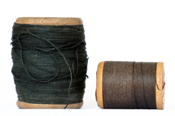 Pair of vintage wooden thread spools rustic needlework concept