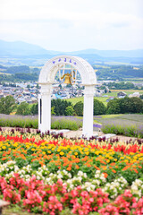Scenic Flower Garden with White Bell Arch and Countryside View, Furano, Hokkaido, Japan