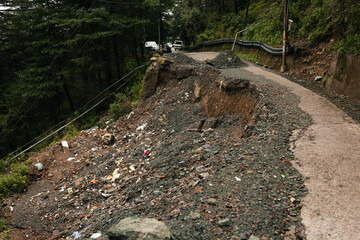 Landslide on mountain road after heavy rain disaster