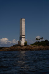 Fototapeta premium Humpback whale in Itacaré Bahia Brazil ocean at sunset with blue textured sea sky and tropical nature wildlife photography