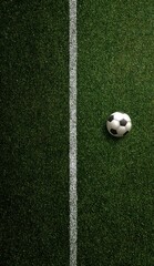 Overhead view of a soccer ball resting on a vibrant green field, positioned near a crisp white sideline