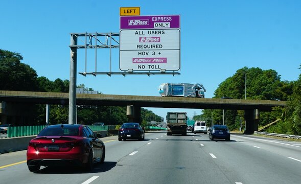 Virginia, U.S.A - Sep 2, 2025 - Overhead sign indicates designated express lane, requiring E-ZPass for all users, including HOV 3+ and E-ZPass Flex users, with no toll collected.
