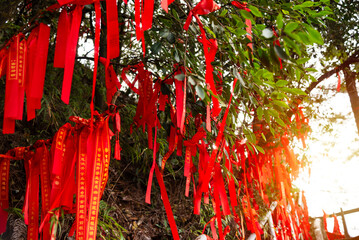 Red ribbons or strings used as blessing in buddhism