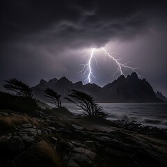 Dramatic lightning illuminates windswept trees and mountains along a stormy coastline at night.