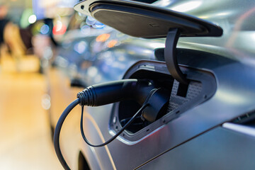 Obraz premium Electric car charger, future car, electric power, clean energy