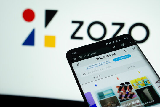 Dhaka, Bangladesh- 03 July 2025: Smartphone displaying ZOZO web interface against ZOZO logo background.
