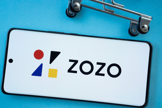 Dhaka, Bangladesh- 03 July 2025: Smartphone screen showing the ZOZO logo with shopping cart wheels on a blue background.