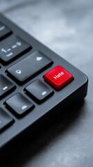 Fototapeta premium Close-up of a black computer keyboard with a red hate key. 