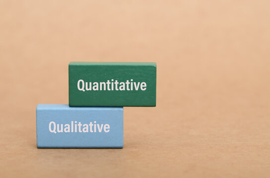 This conceptual image uses colored blocks to differentiate between quantitative (numerical) and qualitative (observational) approaches in research, business, and academic studies.