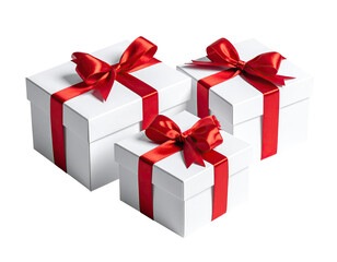 Obraz premium Three white gift boxes, stacked, tied with red ribbon