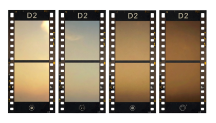 Four different color variations of a landscape image, presented as film frames
