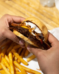 hand holding french fries