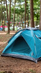 Bright blue tent set up in a forested campsite with colorful lights overhead during a sunny summer day