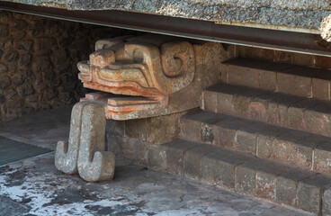 Teotihuacan, Mexico - 1 December 2022: Detailed snake head is the representation of the god Quetzalcoatl at the temple of the Feathered Serpent