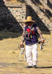 Teotihuacan, Mexico - 1 December 2022: Local sellers of souvenirs at the  pyramid of the Sun of Teotihuacan