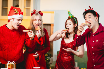 A cheerful group of diverse friends gathers around a decorated Christmas tree, exchanging gifts with laughter and joy at a festive holiday party.