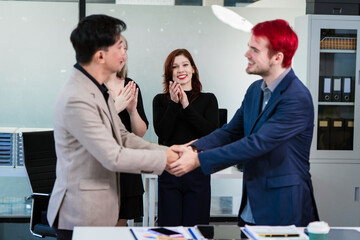 Diverse business team collaborates in modern office, discussing charts, data, strategies. Their professional teamwork reflects communication, leadership, success, productive, innovation cooperation.