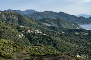 Naklejka premium Village beach view Roadtrip Winding road along rocky coast of Cap Corse peninsula on Corsica island France