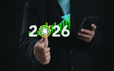 Businessman showing growth chart with year 2026, symbolizing success, target achievement, financial planning, investment, and corporate vision for future progress.
