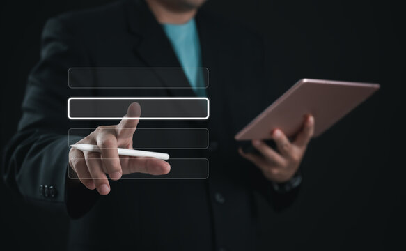 Business professional selecting digital menu option with stylus on virtual interface while holding tablet. Concept of UI design, technology, data input, and modern interactive user experience.