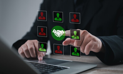 Office professional selecting candidate profile with handshake icon on digital interface. Concept of collaboration, teamwork, recruitment, partnership, and human resources cooperation.