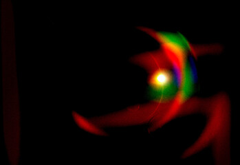 Abstract colorful background with bright circular light pattern and glowing blue fractal energy