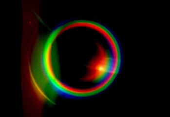 Abstract colorful background with bright circular light pattern and glowing blue fractal energy