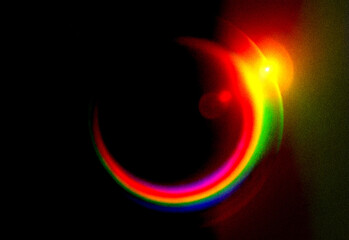 Abstract colorful background with bright circular light pattern and glowing blue fractal energy