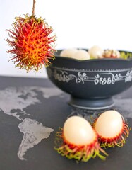Rambutan fruit in bowl