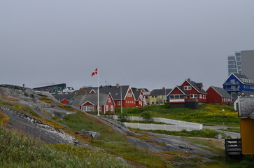 Colorful Houses with Danish Flag in Nuuk Greenland © Rami