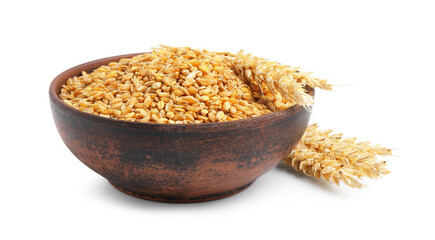 Wheat grains in bowl and dry spikes isolated on white