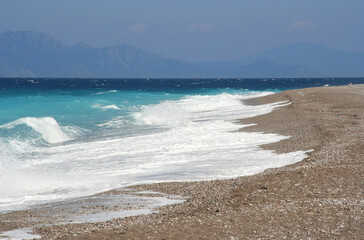 Surf on the beach of Rhodes island in Greece.
