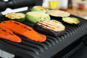 Electric grill with different tasty vegetables, closeup