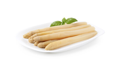 Pickled asparagus spears with basil isolated on white