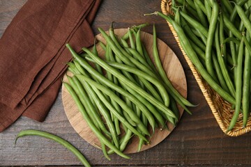 Fresh green bean pods on wooden table, flat lay