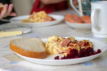 Breakfast with scrambled eggs and beet salad