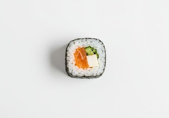 An individual salmon and cream cheese sushi roll, viewed from above, on a white background