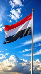 Flag waving in vibrant sky