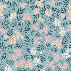 Beautiful spring floral pattern in small abstract flowers. Small pale flowers. Gray blue background. Liberty print. Floral seamless background. Cute template for fashion prints. Stock vector pattern
