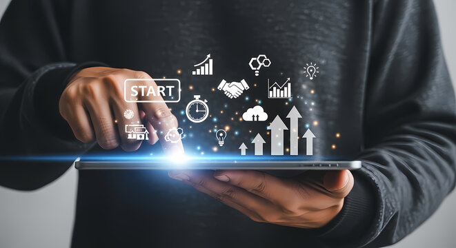 Businessman touching a 'START' button on a digital tablet, launching a new project with holographic icons for growth, strategy, and success. - Powered by Adobe